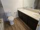 Bathroom with double vanity and wood-look floors at 1732 Monte Alban Dr, North Las Vegas, NV 89031