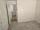 Small bedroom with wood-look floors and doorway at 1732 Monte Alban Dr, North Las Vegas, NV 89031