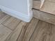 Close up of wood and tile flooring at 1732 Monte Alban Dr, North Las Vegas, NV 89031