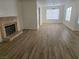 Bright living room with fireplace and hardwood floors at 1732 Monte Alban Dr, North Las Vegas, NV 89031