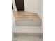 Modern staircase with light gray tile and wood-look flooring at 1732 Monte Alban Dr, North Las Vegas, NV 89031