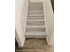 Modern stairs with wood-look tile flooring at 1732 Monte Alban Dr, North Las Vegas, NV 89031