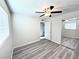 Well-lit bedroom with mirrored closet and ceiling fan at 1972 H St, Las Vegas, NV 89106