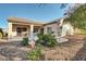 Landscaped backyard with gravel, plants, and a patio at 2067 Bliss Corner St, Henderson, NV 89044