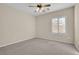 Simple bedroom with carpet flooring and ceiling fan at 2067 Bliss Corner St, Henderson, NV 89044