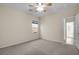 Well-lit bedroom featuring a ceiling fan and access to another room at 2067 Bliss Corner St, Henderson, NV 89044