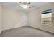 Bright bedroom with ceiling fan and neutral carpeting at 2067 Bliss Corner St, Henderson, NV 89044