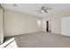 Simple bedroom with carpet, ceiling fan and window with shutters at 2067 Bliss Corner St, Henderson, NV 89044