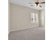 Simple bedroom with carpet flooring and ceiling fan at 2067 Bliss Corner St, Henderson, NV 89044