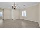 Bright dining room featuring a chandelier and tile flooring at 2067 Bliss Corner St, Henderson, NV 89044