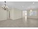 Spacious dining room with tile floors and elegant chandelier at 2067 Bliss Corner St, Henderson, NV 89044