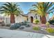 House exterior with two palm trees and well-manicured landscaping at 2067 Bliss Corner St, Henderson, NV 89044