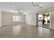 Bright living room with tile floors, sliding glass door, and ceiling fan at 2067 Bliss Corner St, Henderson, NV 89044