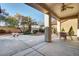 Covered patio with ceiling fan and seating area at 2067 Bliss Corner St, Henderson, NV 89044