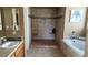 Large bathroom with a walk-in shower and a bathtub at 2221 E Winery Rd, Pahrump, NV 89048