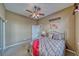 Bright bedroom with a comfortable bed and ceiling fan at 2221 E Winery Rd, Pahrump, NV 89048