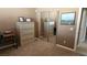 Bedroom with mirrored closet doors and home office at 2221 E Winery Rd, Pahrump, NV 89048