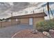 This exterior of a utility building is surrounded by gravel and desert foliage at 2221 E Winery Rd, Pahrump, NV 89048