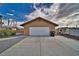 A nice detached garage with gravel landscaping and a new concrete driveway at 2221 E Winery Rd, Pahrump, NV 89048