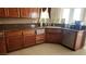 Spacious kitchen with ample cabinetry, granite countertops, and a large sink at 2221 E Winery Rd, Pahrump, NV 89048