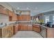 Functional kitchen featuring ample counter space, cabinetry, and a stainless steel dishwasher at 2221 E Winery Rd, Pahrump, NV 89048