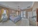 Spacious main bedroom boasting a ceiling fan, generous natural light, and an ensuite bathroom at 2221 E Winery Rd, Pahrump, NV 89048