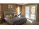 Spacious main bedroom with a king-size bed and access to the backyard at 2221 E Winery Rd, Pahrump, NV 89048