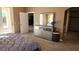 Main bedroom with dresser, walk-in closet, and access to bathroom at 2221 E Winery Rd, Pahrump, NV 89048