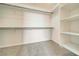 Walk-in closet with shelving and rods for ample storage at 2221 E Winery Rd, Pahrump, NV 89048