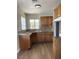 Cozy kitchen with wood cabinets and granite countertops at 2410 Poplar Ave, Las Vegas, NV 89101