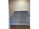 Laundry area with a shelf and hookups for washer/dryer at 2410 Poplar Ave, Las Vegas, NV 89101