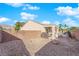 Landscaped backyard with gravel and a block wall at 2525 Shore Bird Ave, North Las Vegas, NV 89084