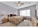 Comfortable bedroom with ceiling fan and large window at 2525 Shore Bird Ave, North Las Vegas, NV 89084