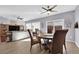 Bright dining area with a round table and four brown chairs at 2525 Shore Bird Ave, North Las Vegas, NV 89084