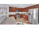 Modern kitchen with stainless steel appliances and wood cabinets at 2525 Shore Bird Ave, North Las Vegas, NV 89084