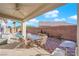 Covered patio with seating area, adjacent to the pool at 2525 Shore Bird Ave, North Las Vegas, NV 89084