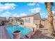 Sparkling pool with a stone border and surrounding patio at 2525 Shore Bird Ave, North Las Vegas, NV 89084