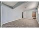 Bedroom with gray carpeting and a view of the bathroom at 2620 Shiloh Way, North Las Vegas, NV 89030