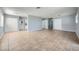 Spacious living room with tile floors and neutral walls at 2620 Shiloh Way, North Las Vegas, NV 89030