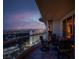 Evening view of city skyline from private balcony with seating area at 2777 Paradise Rd # 3701, Las Vegas, NV 89109