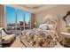 Guest bedroom with a floral comforter and city views at 2777 Paradise Rd # 3701, Las Vegas, NV 89109