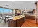 Granite kitchen island, dark wood cabinets, and city views at 2777 Paradise Rd # 3701, Las Vegas, NV 89109