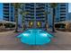 Inviting pool area with comfortable seating and building view at 2777 Paradise Rd # 3701, Las Vegas, NV 89109