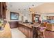 Modern wet bar with a curved granite countertop and stylish cabinetry at 2777 Paradise Rd # 3701, Las Vegas, NV 89109