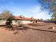 Large backyard with gravel landscaping and covered patio at 311 E Desert Rose Dr, Henderson, NV 89015