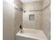 Updated bathroom with tile shower/tub combo at 311 E Desert Rose Dr, Henderson, NV 89015