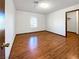 Spacious bedroom with hardwood floors and large window at 311 E Desert Rose Dr, Henderson, NV 89015