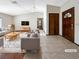 Virtually staged living room featuring a neutral color palette and hardwood floors at 311 E Desert Rose Dr, Henderson, NV 89015