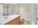 Simple bathroom with wood vanity, single sink and shower/tub combo at 33 Gentilly Lace Ave, Henderson, NV 89002