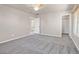 Bright bedroom with grey carpet, ceiling fan and ample closet space at 33 Gentilly Lace Ave, Henderson, NV 89002